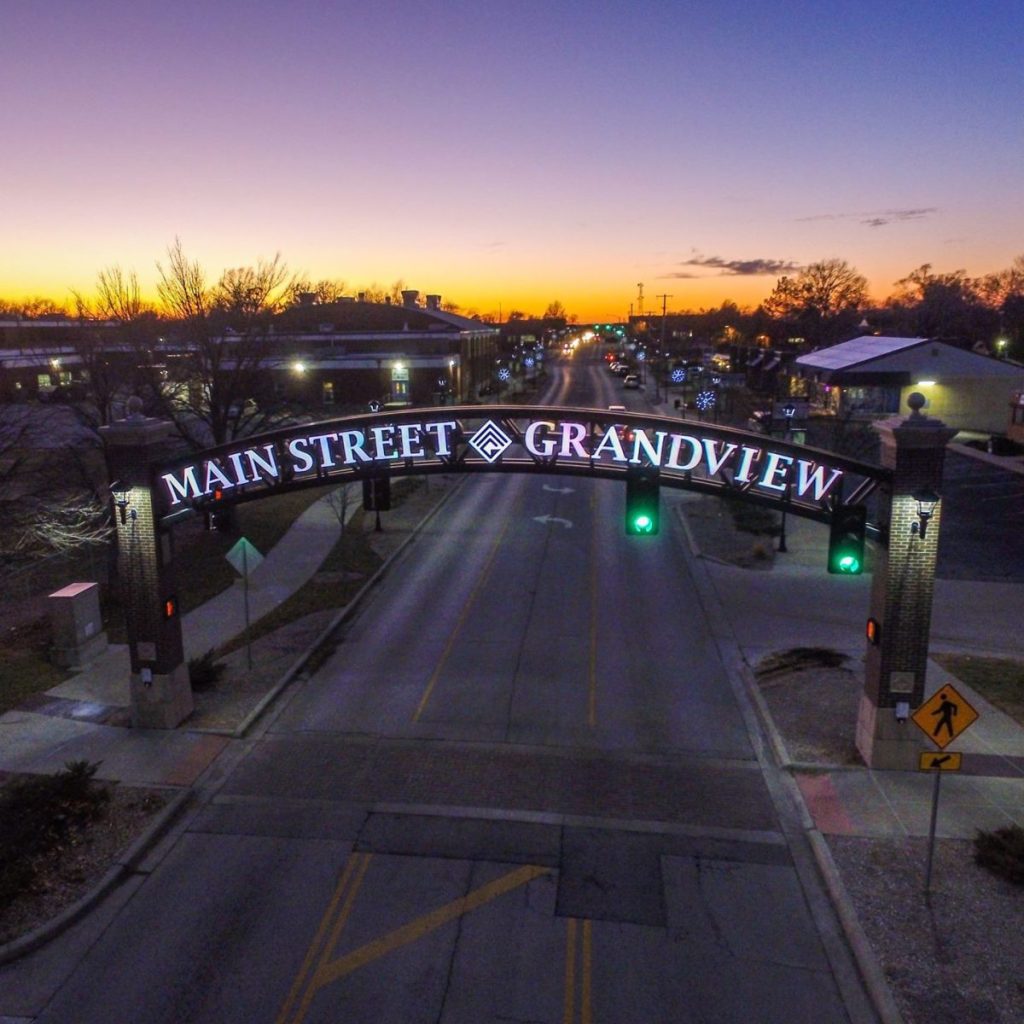 Main Street Grandview Missouri entrance sign at sunset with roadway and city view near Kansas City for local drug rehab and addiction treatment services